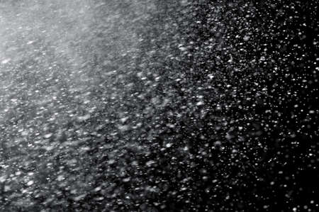 abstract splashes of water on a black backgroundの写真素材