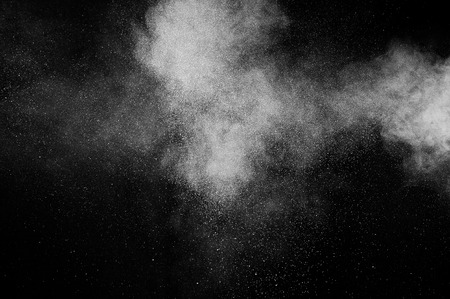 abstract white powder explosion  on black backgroundの写真素材