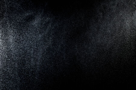 abstract splashes of water on a black backgroundの写真素材