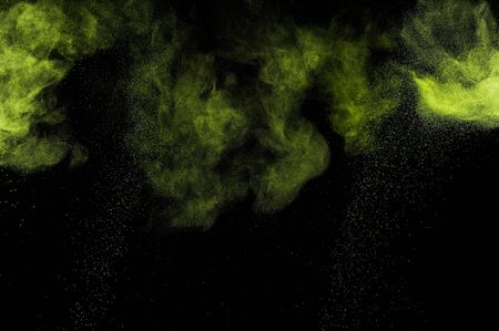 Abstract green paint Holi. Abstract green powder explosion  on black background.の写真素材
