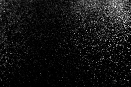 abstract splashes of milk on a black backgroundの写真素材