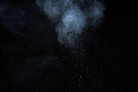 abstract white powder explosion  on black background