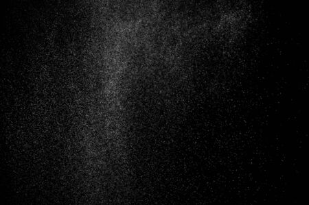 abstract spray of water on a black backgroundの写真素材