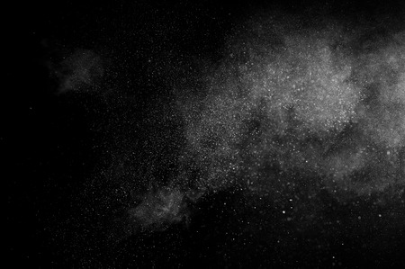 abstract white powder explosion  on a black backgroundの写真素材