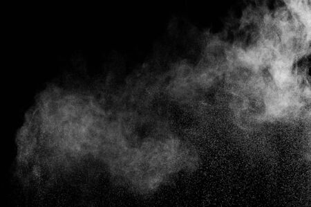 abstract white dust explosion  on a black background. abstract white powder. design elements. abstract texture.の写真素材