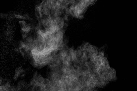 abstract white dust explosion  on a black background. abstract white powder. design elements....