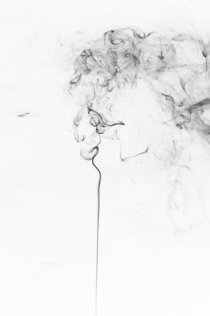 Abstract black smoke on a white backgroundの写真素材