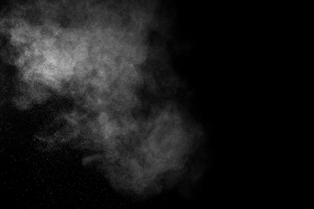 abstract white dust explosion  on a black background. abstract white powder. design elements. abstract texture.の写真素材