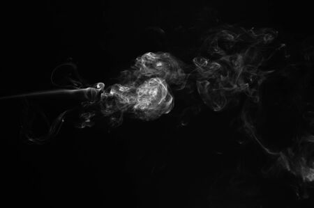 Abstract smoke moves on a black background. Design element. Abstract texture.