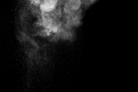 abstract white dust explosion  on a black background. abstract white powder. design elements. abstract texture.の写真素材