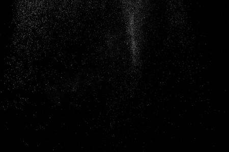 abstract white dust explosion  on a black background. abstract white powder. design elements. abstract texture.の写真素材