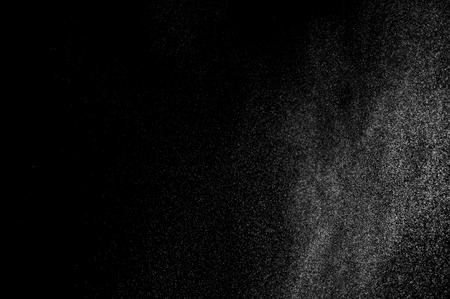 abstract splashes of water on a black background. splashes of milk. abstract spray of water. abstract rain. shower water drops.  white dust explosion. abstract texture. abstract black background.の写真素材