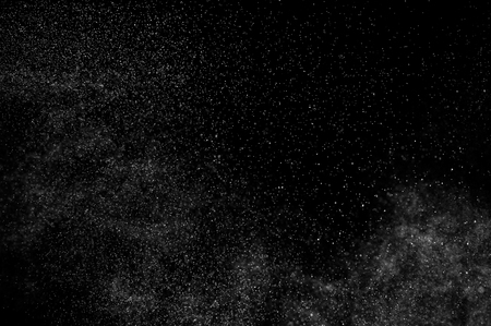 abstract splashes of water on a black background. abstract spray of water. abstract rain. shower water drops. abstract texture.の写真素材