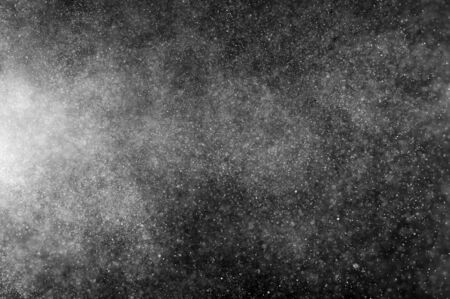 abstract splashes of water on  black background. abstract spray of water. abstract rain. shower water drops. abstract texture.の写真素材