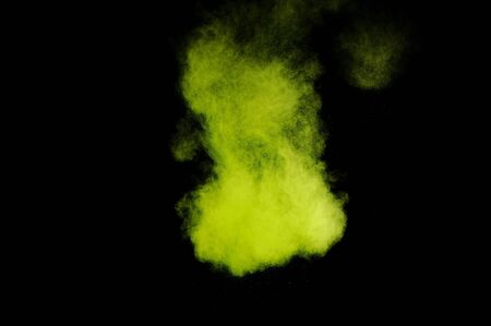 Light green powder explosion on black background. Colored powder cloud. Colorful dust explode. Paint  Holi.の写真素材