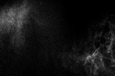 abstract splashes of milk on a black backgroundの写真素材