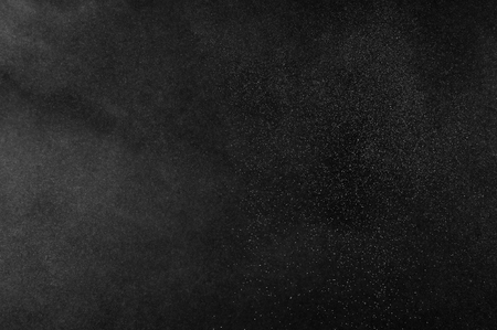 White powder explosion on black background. Abstract  dust texture.の写真素材