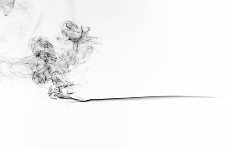 Freeze motion of black smoke isolated on white background. Abstract vape clouds.の写真素材