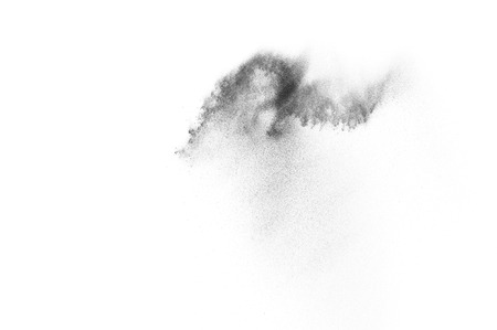 Black particles explosion isolated on white background.  Abstract dust overlay texture.の写真素材