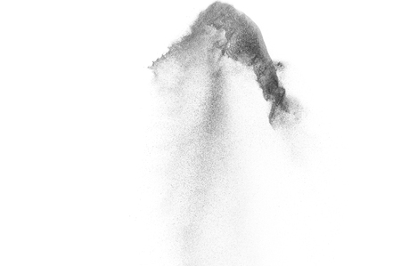 Black particles explosion isolated on white background.  Abstract dust overlay texture.の写真素材