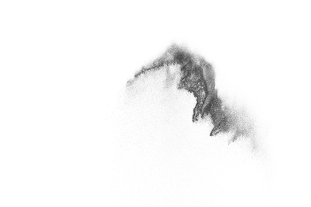 Black particles explosion isolated on white background.  Abstract dust overlay texture.の写真素材