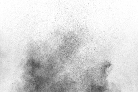 Black particles explosion isolated on white background.  Abstract dust overlay texture.
