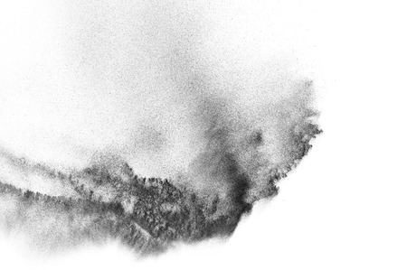 Black particles explosion isolated on white background.  Abstract dust overlay texture.の写真素材
