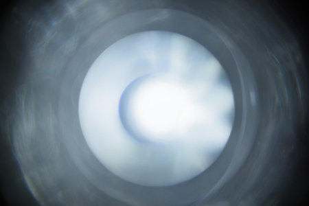 Luminous spots. Abstract lighting glare on black background. Out of focus, blur.の写真素材