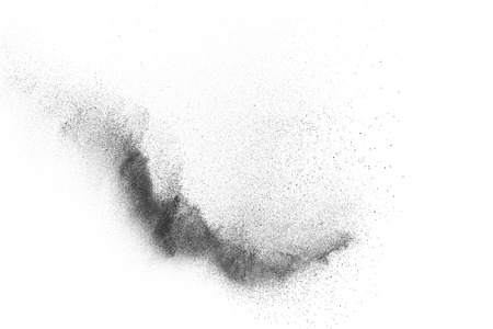 Black particles explosion isolated on white background.  Abstract dust overlay texture.の写真素材