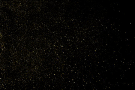 Gold Glitter Texture Isolated on Black Background. golden stardust. Amber Particle Color. Sparkles Rain. Vector illustration, Eps 10.のイラスト素材