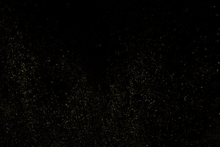 Gold Glitter Texture Isolated on Black Background. golden stardust. Amber Particle Color. Sparkles Rain. Vector illustration, Eps 10.のイラスト素材