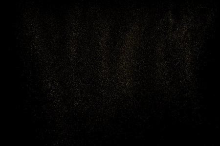 Gold Glitter Texture Isolated on Black Background. golden stardust. Amber Particle Color. Sparkles Rain. Vector illustration, Eps 10.のイラスト素材