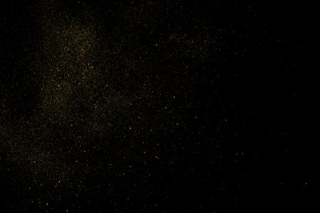 Gold Glitter Texture Isolated on Black Background. golden stardust. Amber Particle Color. Sparkles Rain. Vector illustration, Eps 10.のイラスト素材