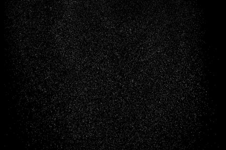 Distressed white grain texture. Dust overlay textured. grain noise particles. Snow effects pack. Rusted black background. Vector illustration, EPS 10.のイラスト素材