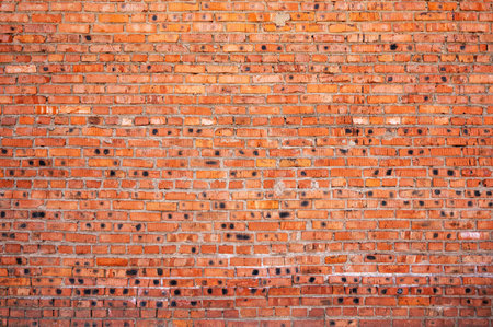Red brick wall background. Old brickwork texture. Rock block pattern. Vintage stonewall. Abstract grunge urban design. Textured surface building.の写真素材