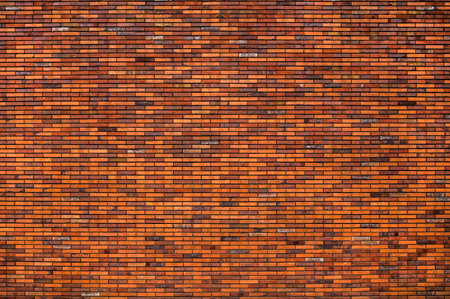 Red brick wall backgrounds. Old brickwork texture. Rock block pattern. Vintage stonewall. Abstract grunge urban design. Textured surface building.の写真素材