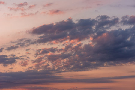 Sky clouds at sunset. Sun cloud nature. Sunrise blue orange evening light.の写真素材