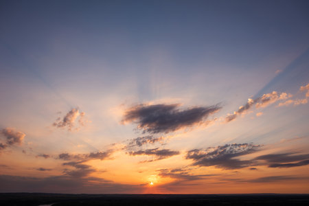 Sunset sky. Sunrise over the river. Dramatic clouds over the landscape. Nature background.の写真素材