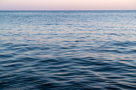 Water blue sea. Lake wave surface. Ocean texture abstract. Waves ripple reflection sunset.の写真素材