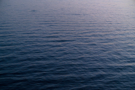 Water blue sea. Lake wave surface. Ocean texture abstract. Waves ripple reflection sunset.の写真素材