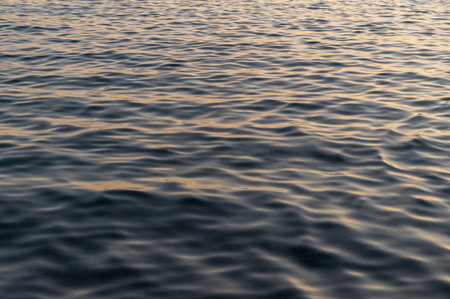 Water blue sea. Lake wave surface. Ocean texture abstract. Waves ripple reflection sunset.の写真素材