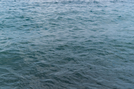 Water blue sea. Lake wave surface. Ocean texture abstract. Waves ripple reflection sunset.の写真素材