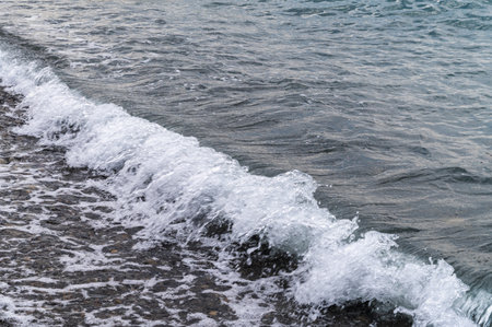 Sea beach. Wave ocean blue. Water splash texture. Surface coast pebbles.