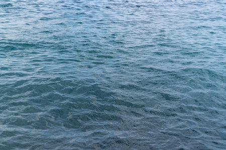 Water blue sea. Lake wave surface. Ocean texture abstract. Waves ripple reflection sunset.の写真素材