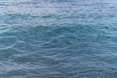 Water blue sea. Lake wave surface. Ocean texture abstract. Waves ripple reflection sunset.の写真素材