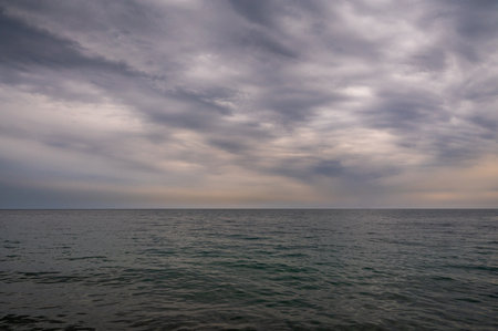 Ocean with sky in horizon. Calm sea in evening. Seascape at sunset.の写真素材