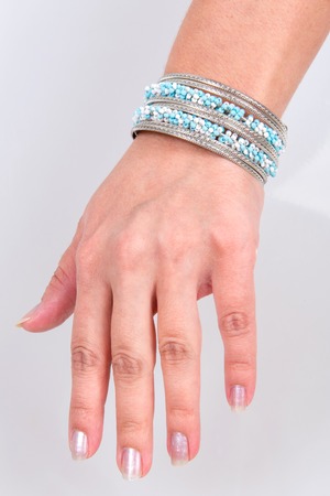 Pearl bracelet on hand at the girl, an ornament of pearls on hand