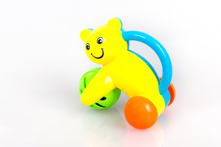 Colorful rattle in the form of a cat with a ball on a white background, Baby Call toy, kids early developmentの写真素材