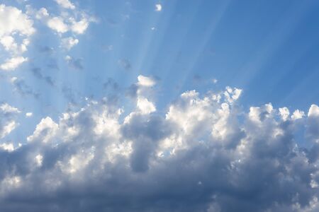 Sunbeam  through the haze on blue sky: can be used as background and dramatic look, sun through the...