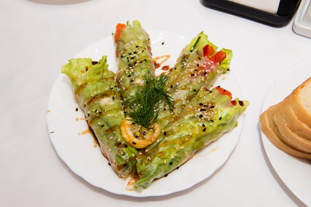Stuffed cabbage with tomato sauce decorated with parsley. The recipe dishes from the chef, cabbage rolls with peppers and meat snack in the restaurant.の写真素材